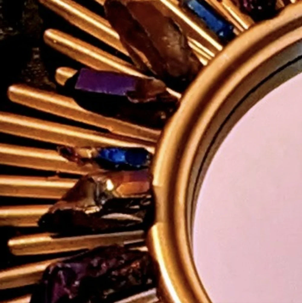 Set of three gold tone wall hanging accent mirrors with titanium coated quartz